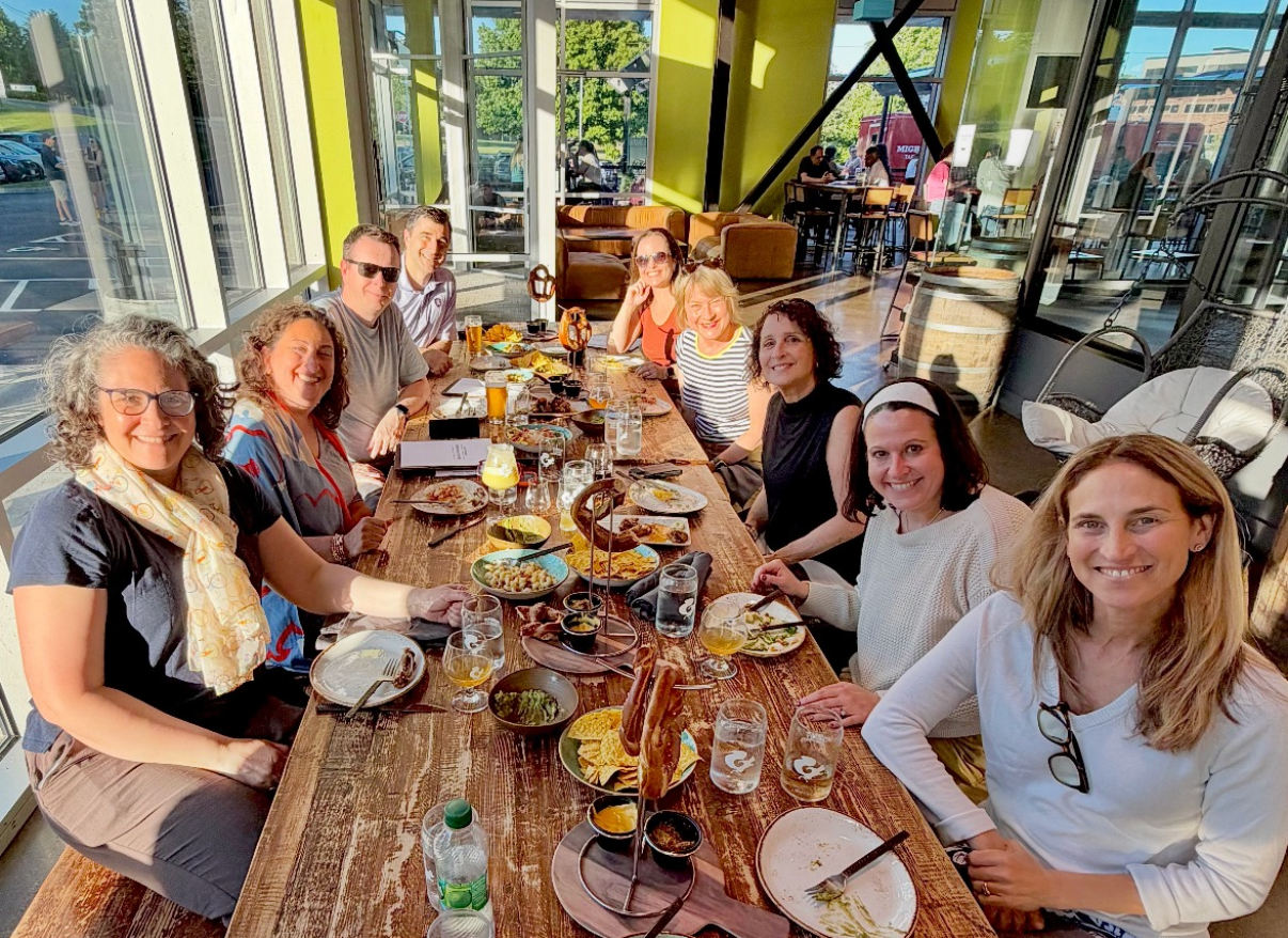 MPA members gathered around a long table at the end-of-year celebration